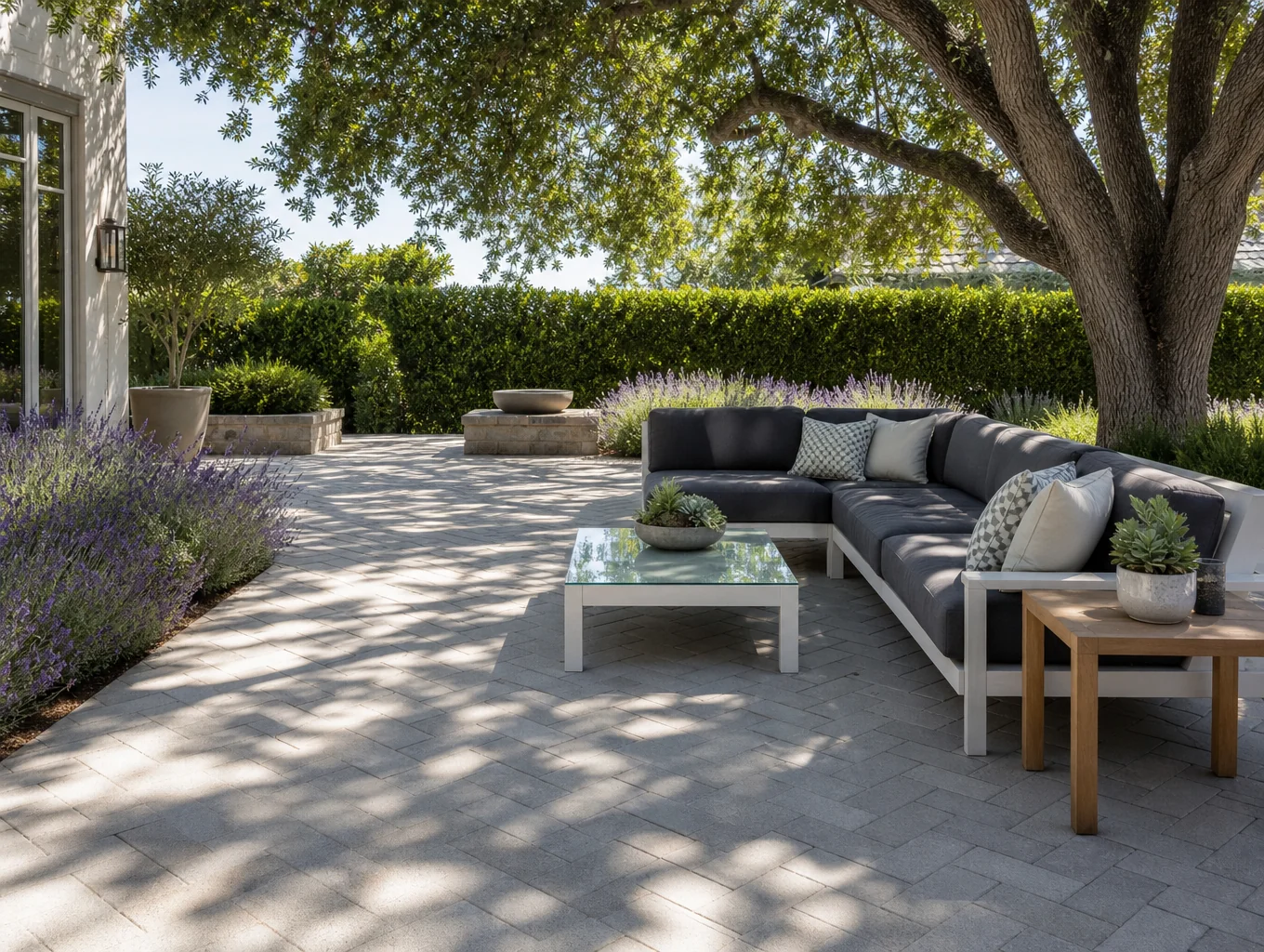 Crafted brick paver patio installation with custom stone borders by concretepro.info